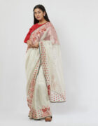 Silver tissue sari with red thread hand enbroidered assorted butas accentuated with mirror and glass beads detail