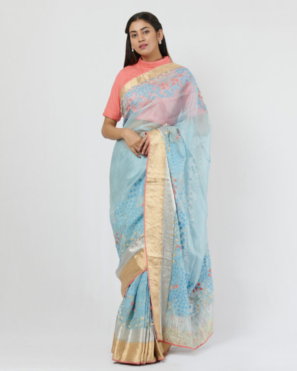Sky blue gold and silver border sari with self thread embroidery running through as a broad border accentuated with contrast thread details