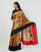 Gold kanchi tissue sari with gota patti and thread hand embroidered assorted butas and black raw silk border