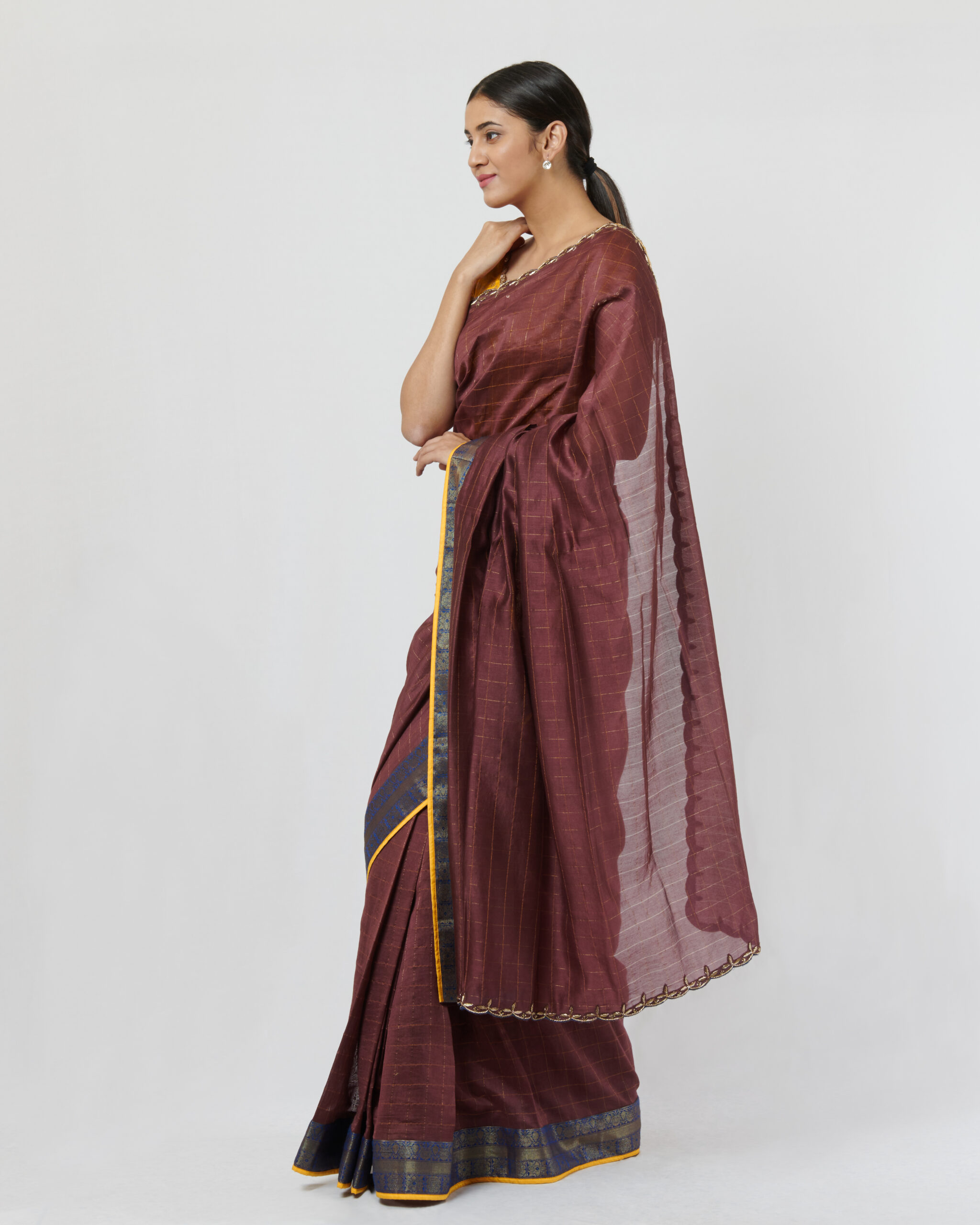 Wine zari checks chanderi sari with a blue benarasi woven border and zardozi embroidery detail on the shoulder and pallu