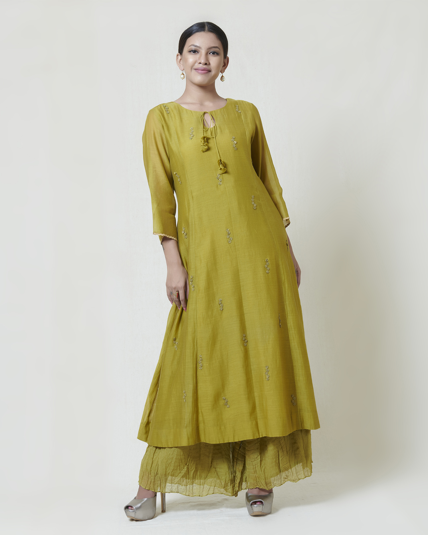 Soft green A line long kurta in kora chanderi with thread hand embroidery butis, paired with crushed pants