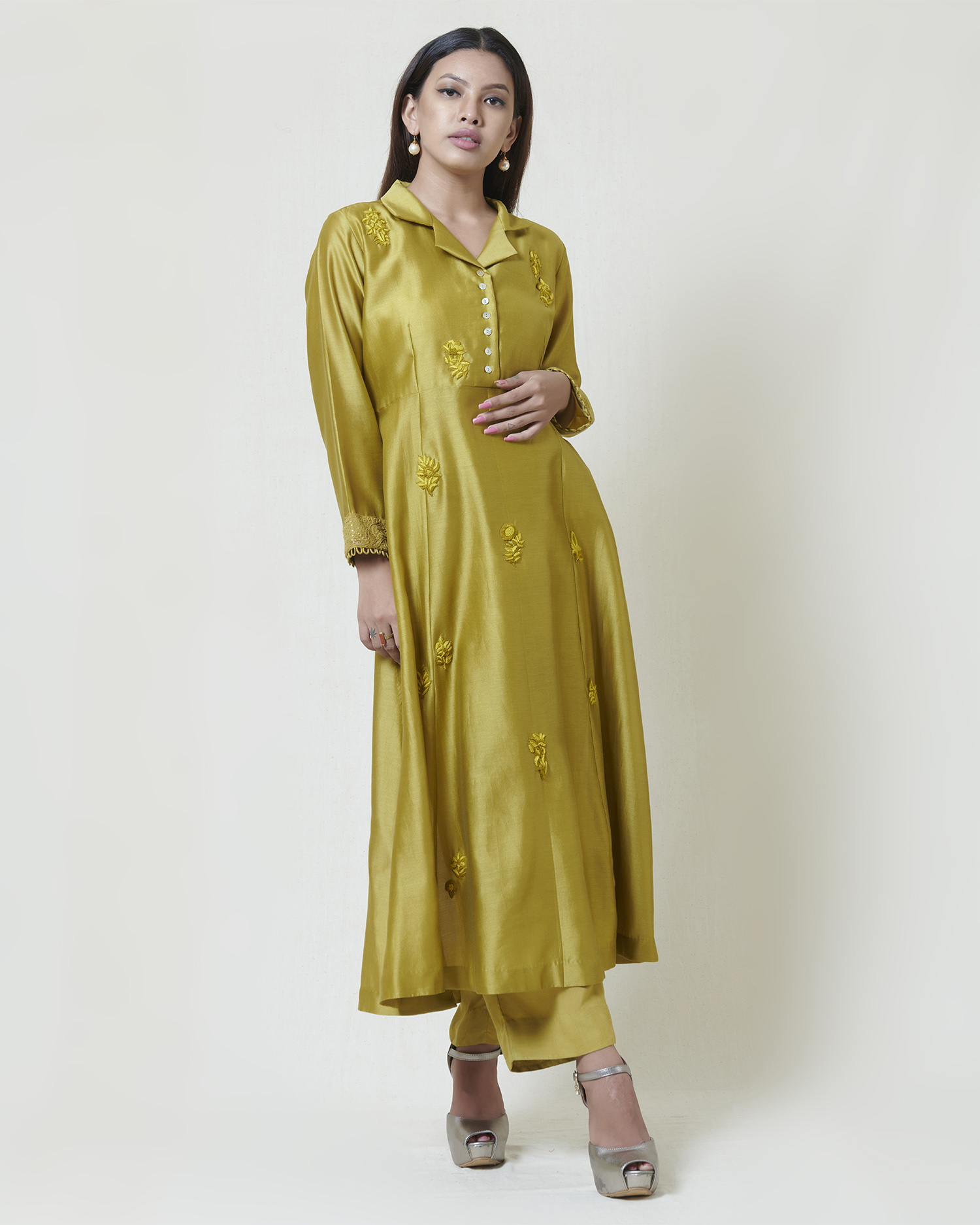 Dark olive coat collar kurta in chanderi with tonal thread hand embroidery and chikankari cuffs highlighted with mukaish. It comes along with a pair of pants.