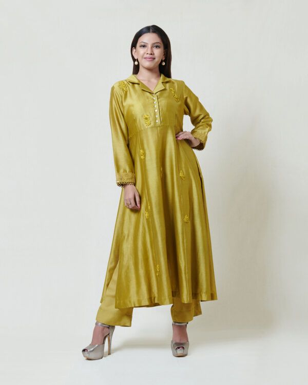 Dark olive coat collar kurta in chanderi with tonal thread hand embroidery and chikankari cuffs highlighted with mukaish. It comes along with a pair of pants.
