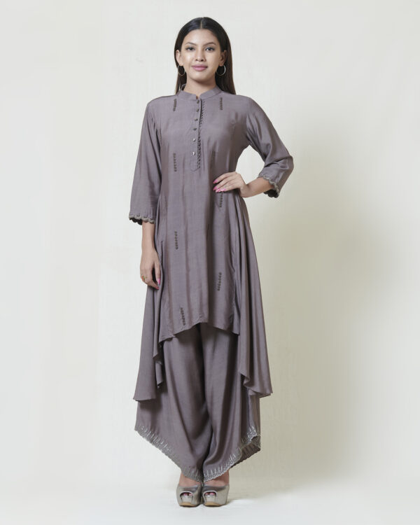 Warm grey tunic with thread spring flowers and silver zardosi cuffs. Draped pants adorned with grey kanchi tissue applique and cutwork details.