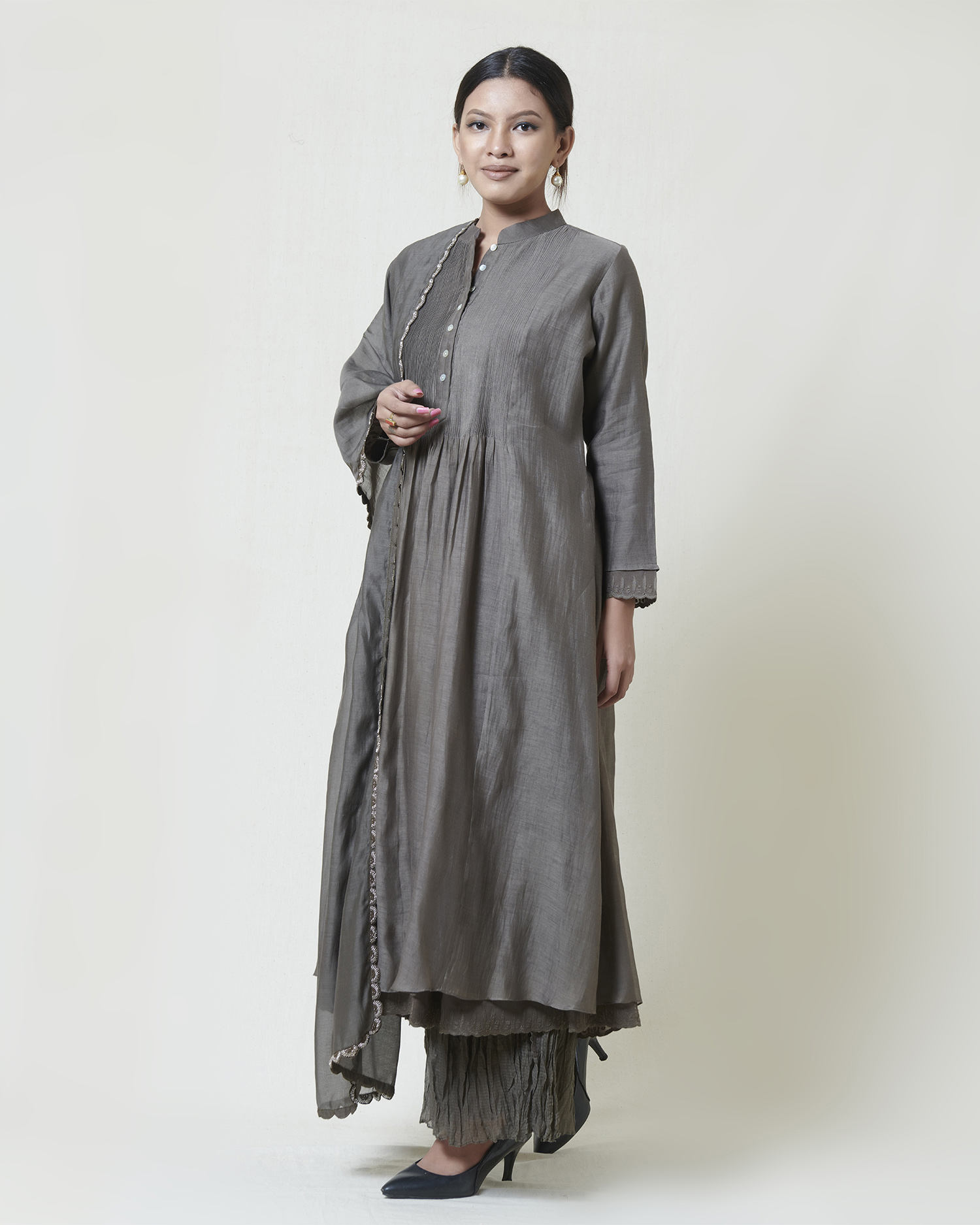 Warm grey kora chanderi kurta layered in mulmul with a pleated bodice detail