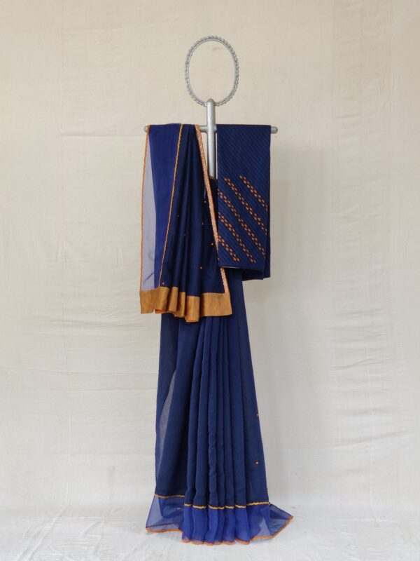 Indigo blue kora chanderi sari with an Organza border with tissue applique and hand thread embroidery details