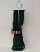 Bottle green kora chanderi sari with an Organza border with tissue applique and hand thread embroidery details