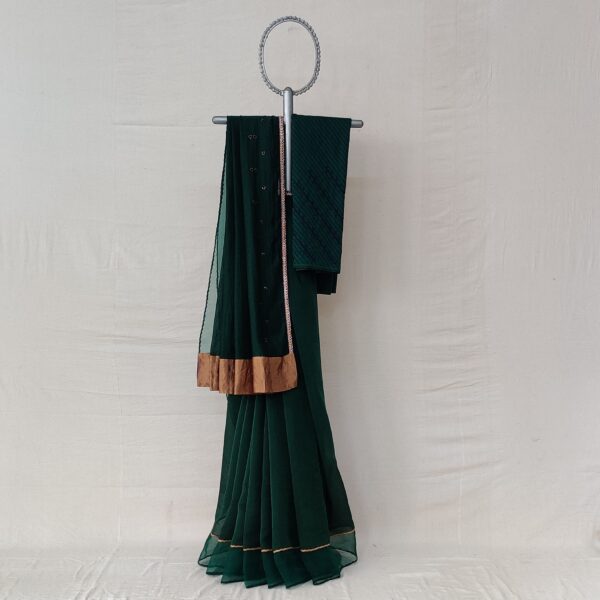 Bottle green kora chanderi sari with an Organza border with tissue applique and hand thread embroidery details
