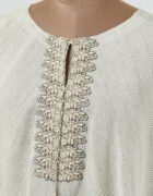 Embroidery: Khadi tunic highlighted with grey applique and cutwork detail hemline and sleeves