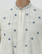 Khadi tunic with spring roses butis and highlighted with indigo applique and cutwork detail hemline and sleeves