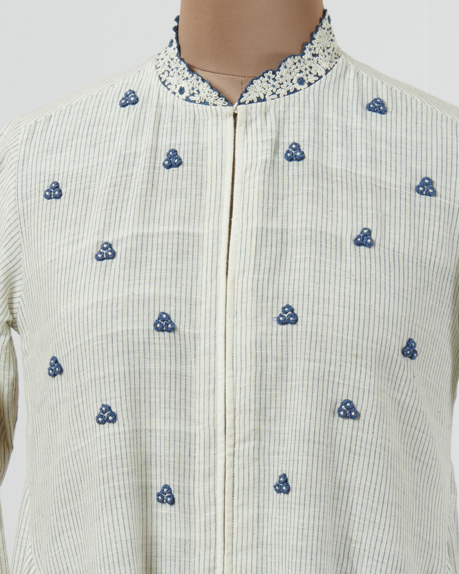 Khadi tunic with spring roses butis and highlighted with indigo applique and cutwork detail hemline and sleeves