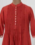 Chilli red dress layered in mulmul with applique and cutwork detail