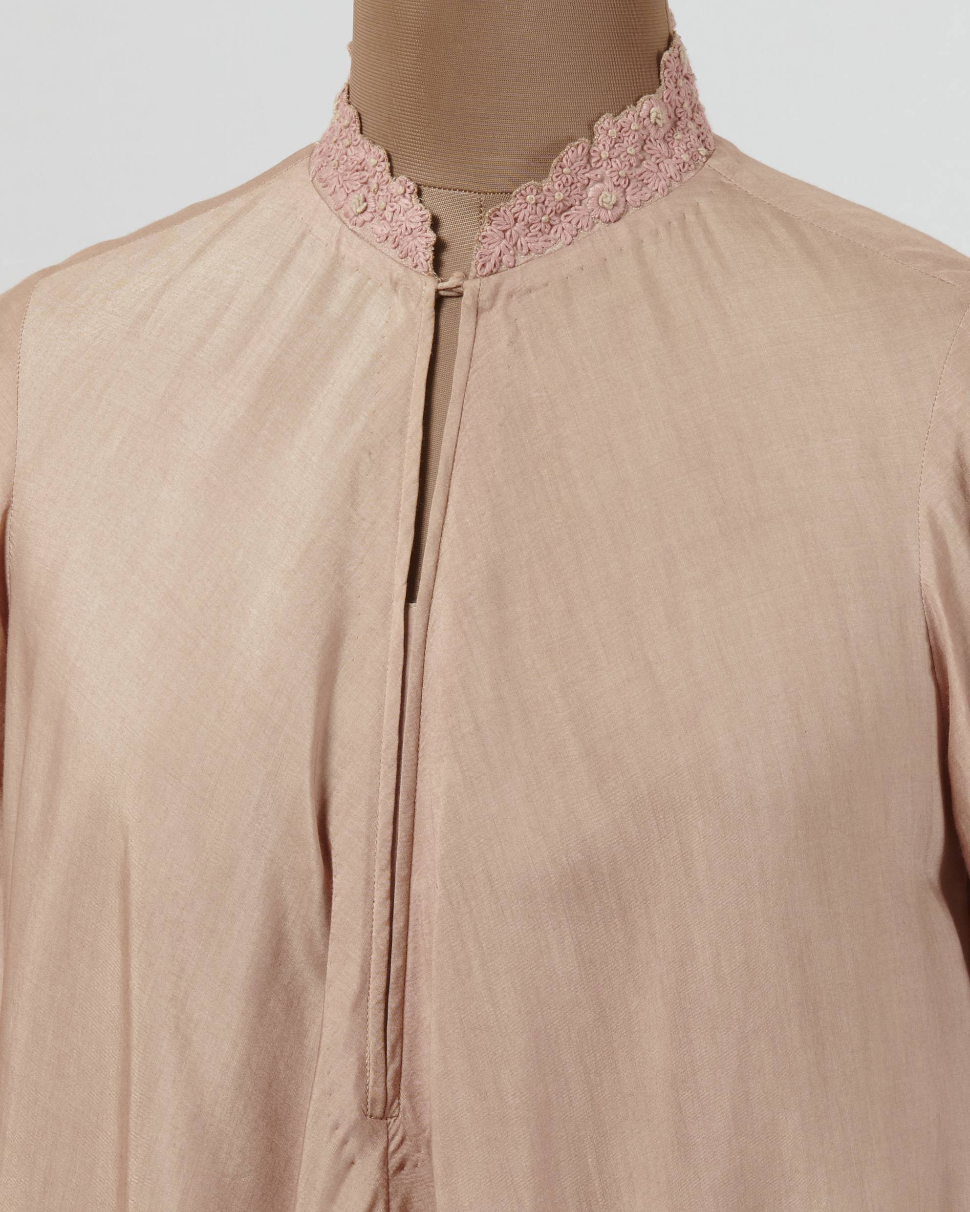 Soft pink tunic with hand embroidered thread collar and cuff details