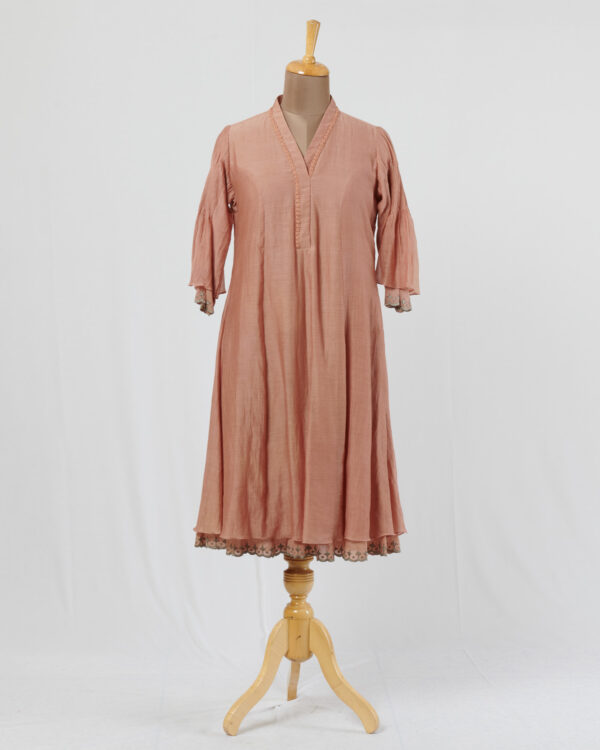 Salmon pink dress layered in mulmul with applique and cutwork detail