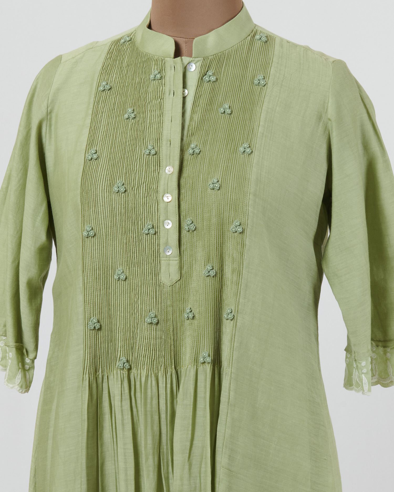 Soft mint dress layered in mulmul with applique and cutwork detail