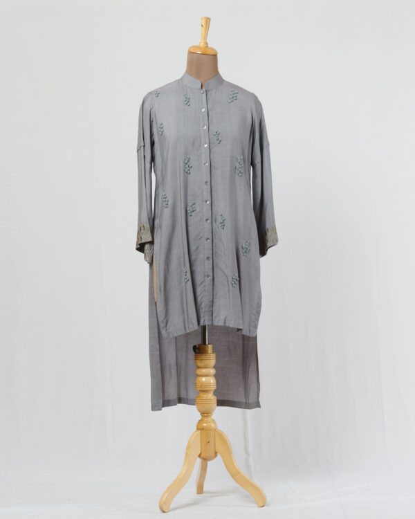 Grey tussar staple high low tunic with thread hand french knot butis all over the front of the tunic and applique detail on the sleeves