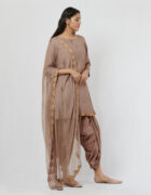 Spun silk kurta with hand crafted potlis and sequence details teamed with a chiffon gold aari hand embroidered dupatta. It comes along with dhoti pants