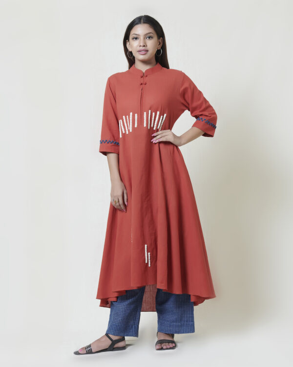 Chilli red high low kurta in khadi with ivory and indigo thread hand embroidery detailing