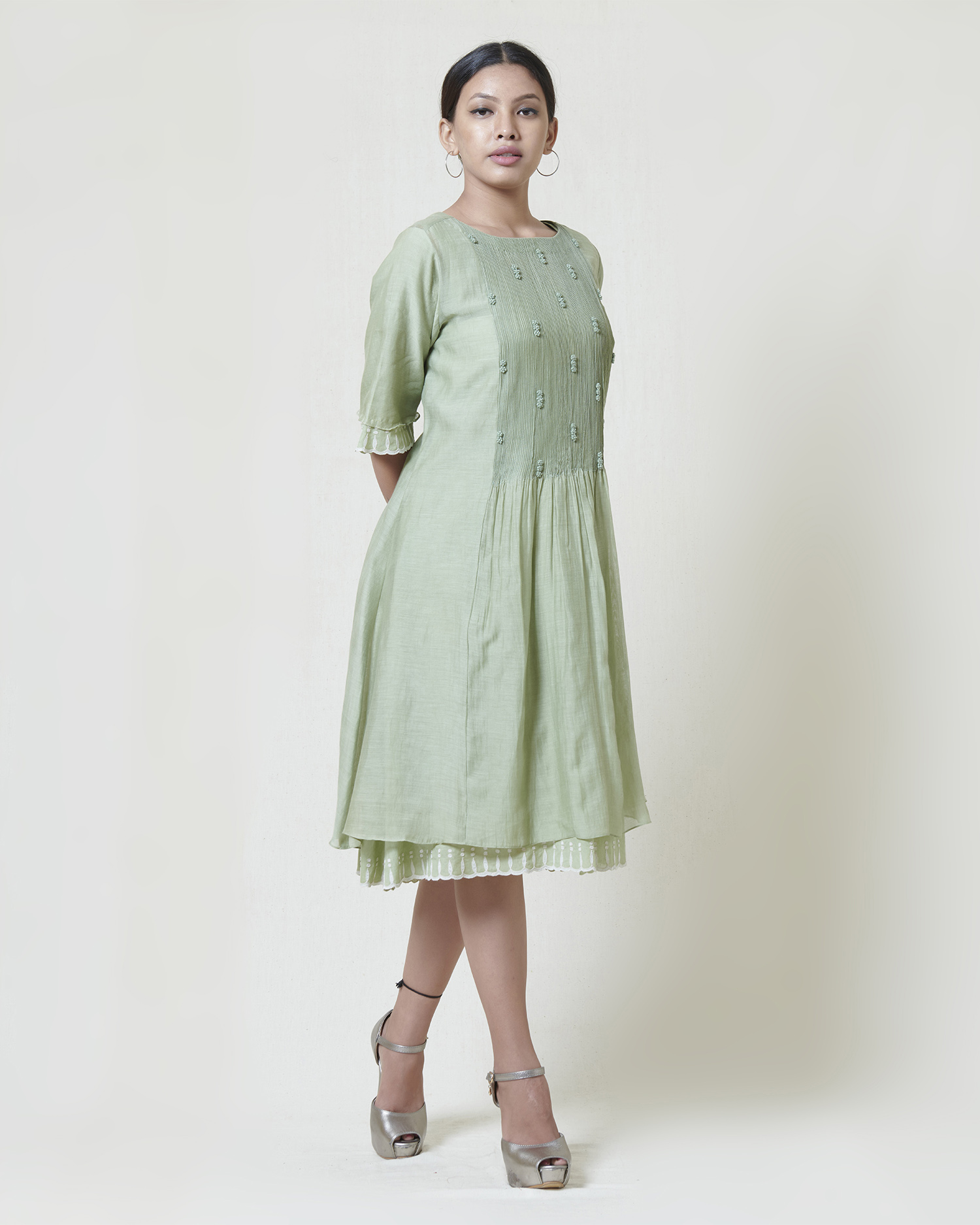 Soft mint dress layered in mulmul with applique and cutwork detail