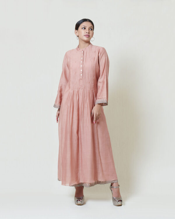 Dusty coral dress in kora chanderi and layered in mul mul with applique and cutwork detailing