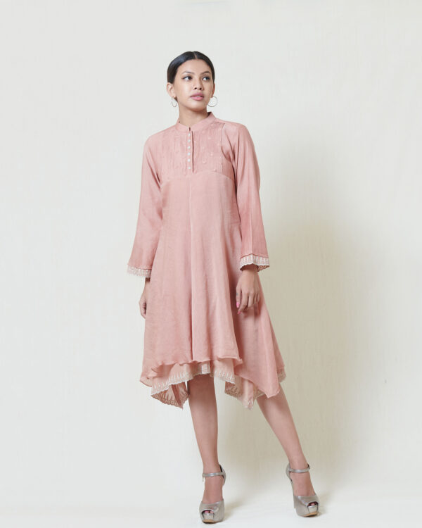 Salmon pink asymmetric dress layered in mulmul with applique and cutwork detail