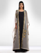 Black kalidar teamed with an ivory poncho hand thread embroidered assorted butas as placements