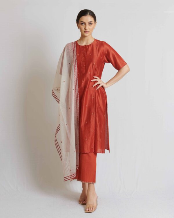 Rust chanderi kurta with hand crafted potlis and scallops applique and cutwork detail