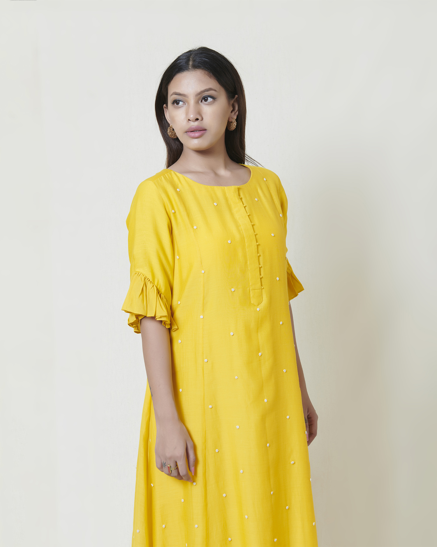 Yellow kora chanderi A line kurta with hand embroidered ivory thread french knot butis