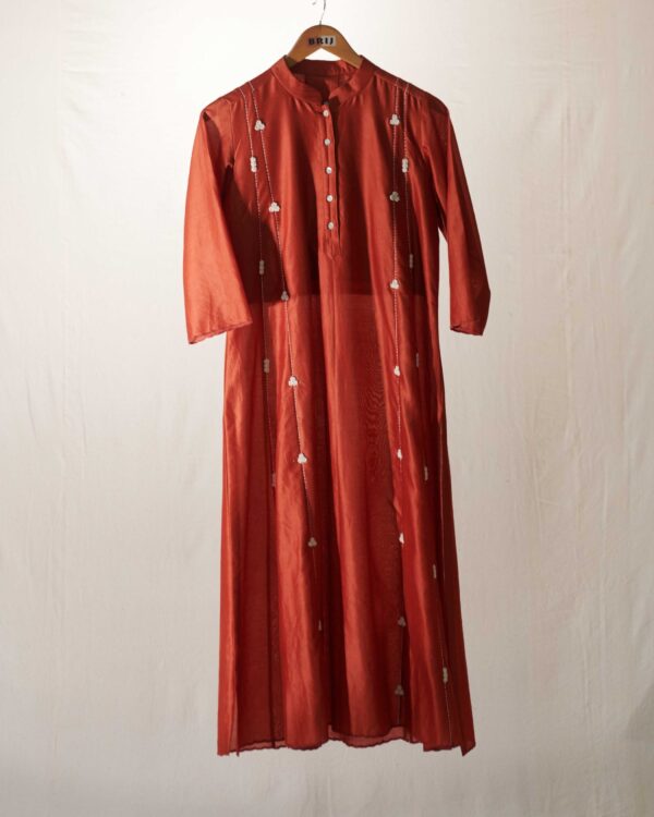 Rust chanderi kurta paired with grey stripes pant