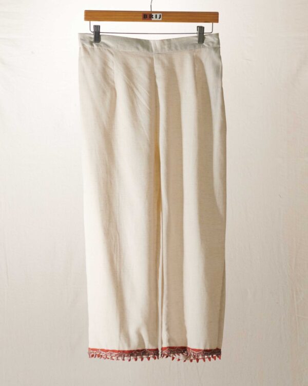 Ivory pant with zardosi on rust fabric edging