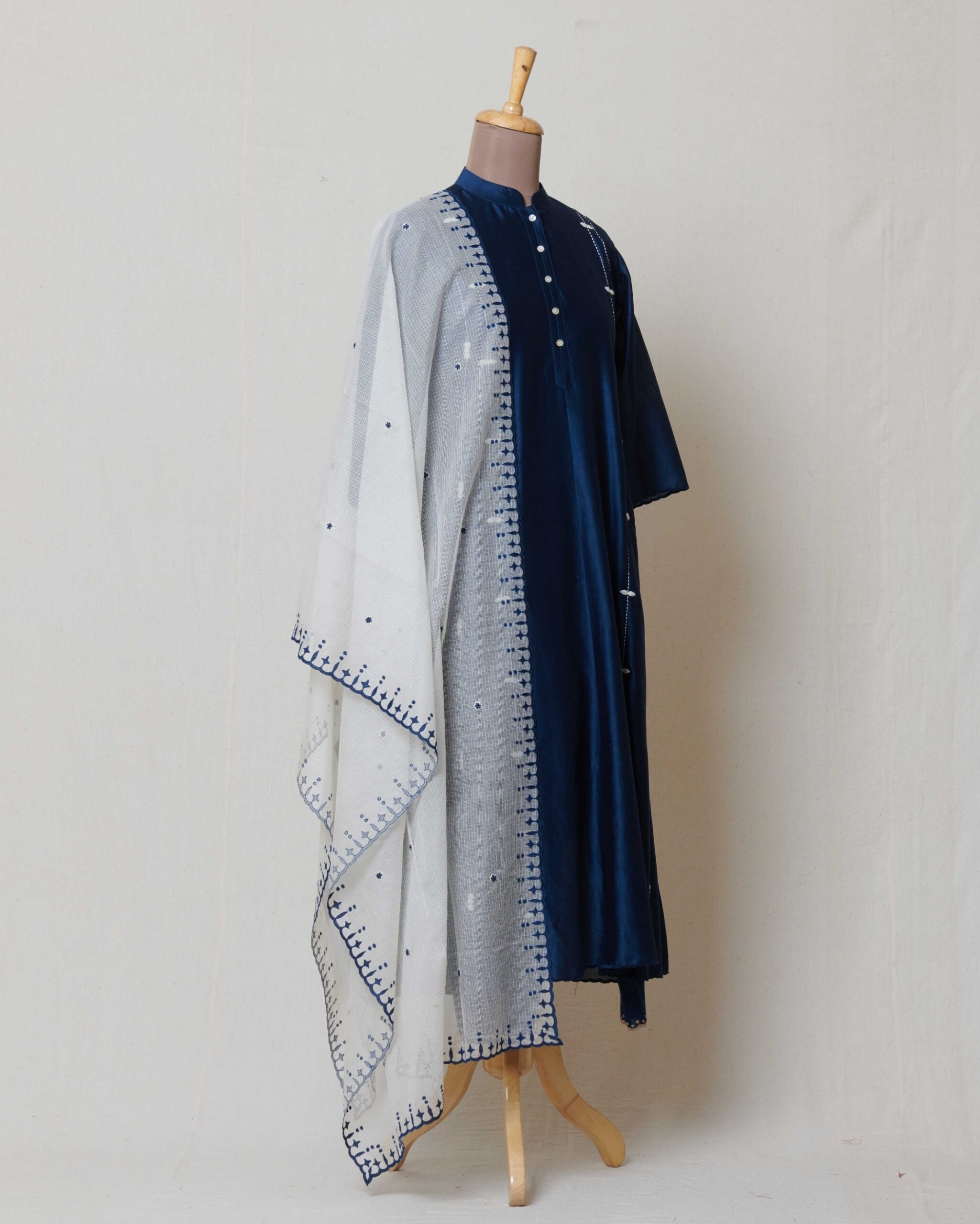 Ivory moonga kota doria dupatta with indigo applique border and highlighted with dull gold and rust butis