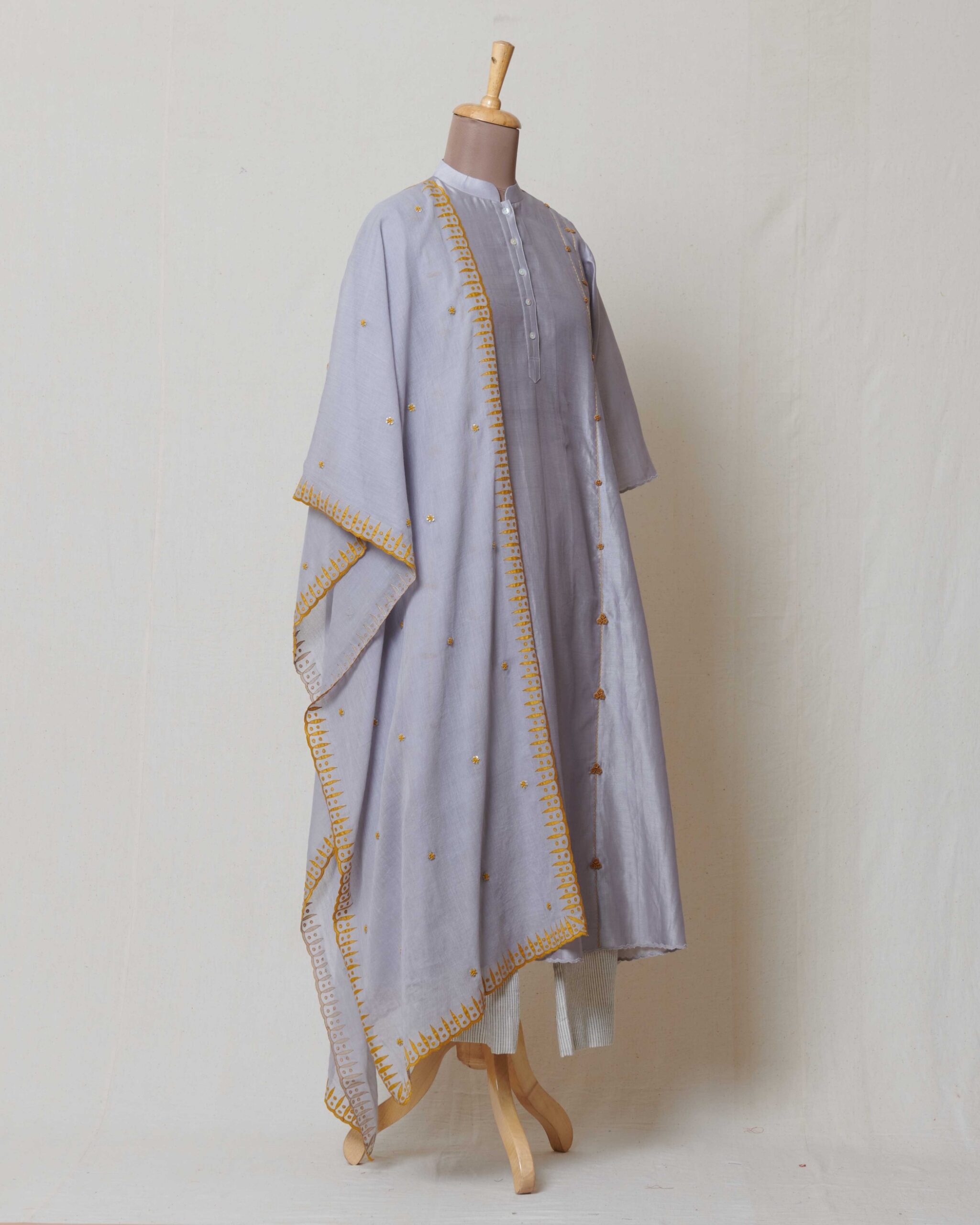 Grey kora chanderi dupatta with yellow applique border and highlighted with dull gold sequence and yellow butis