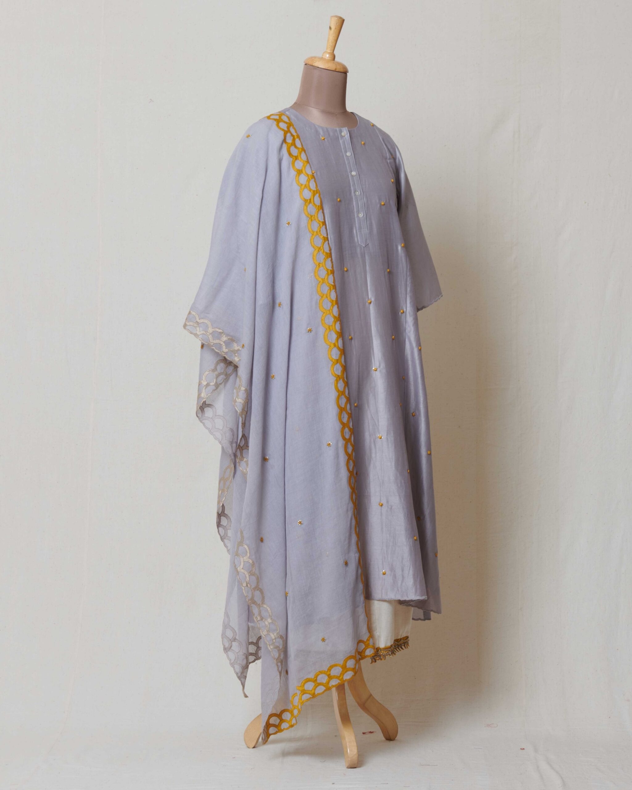 Grey kora chanderi dupatta with yellow and dull gold applique border and highlighted with dull gold and yellow butis