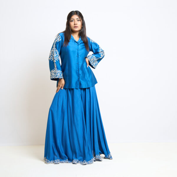 "Electric blue blazer top with flared divided pant