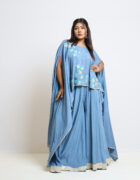 "Pastel blue cape and divided skirt with silver tissue border